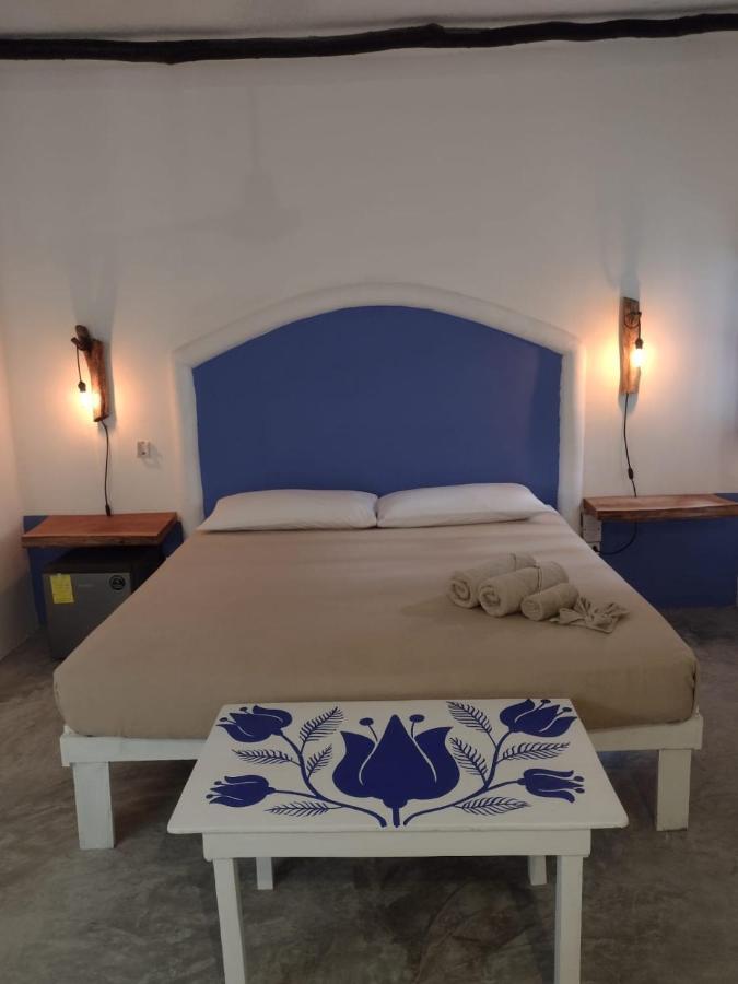 Mio Tulum Hotel Boutique Bagian luar foto A bedroom in a hotel