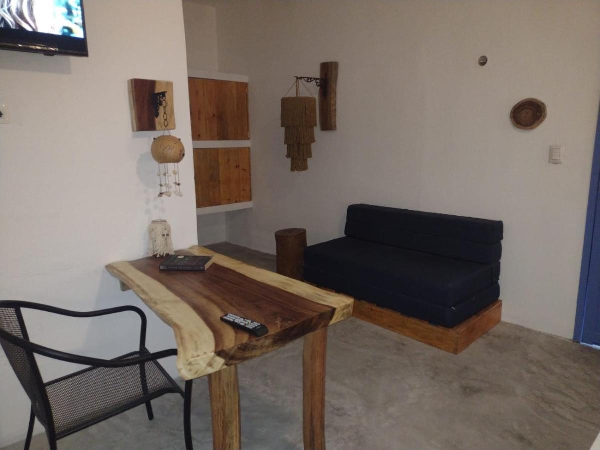 Mio Tulum Hotel Boutique Bagian luar foto A living room in a hotel in Greece