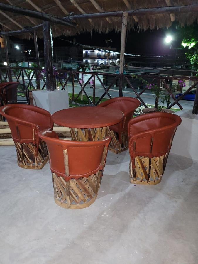 Mio Tulum Hotel Boutique Bagian luar foto A set of equipales