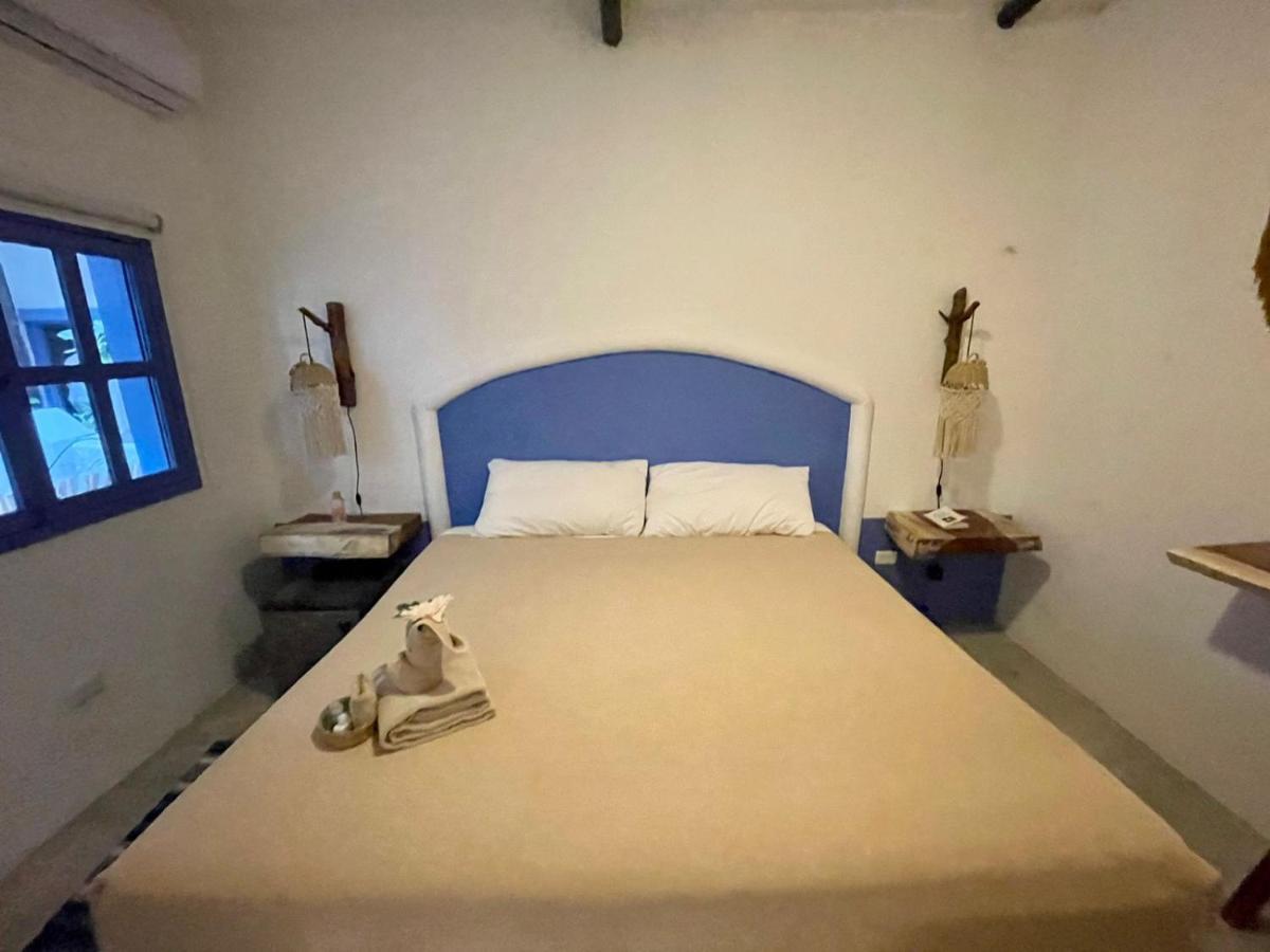 Mio Tulum Hotel Boutique Bagian luar foto A bedroom in the hotel